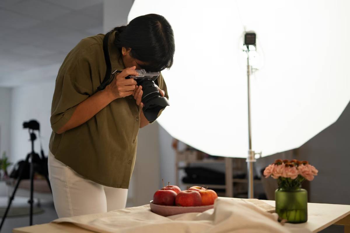 A girl take shoot and click a photo by using camera
